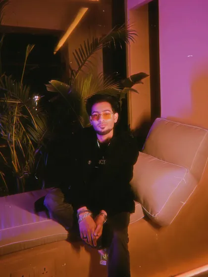 A relaxed moment during a shoot at Silly, Delhi. The purple and orange lighting reflects the modern, stylish vibe of my brand.