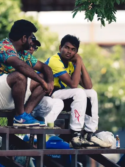 A coach and driver debriefing on the stands after a session.