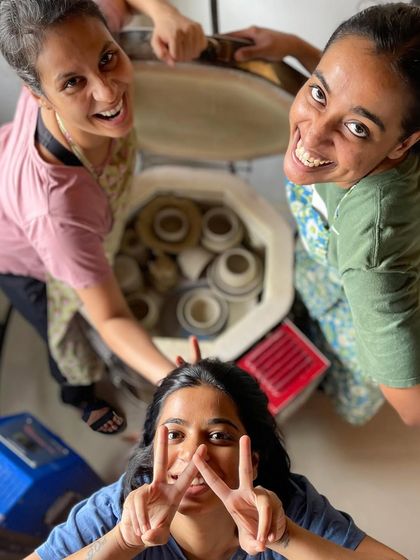 A moment of triumph and teamwork as our professional students load their creations into the kiln for firing, a critical and exciting step in their journey.