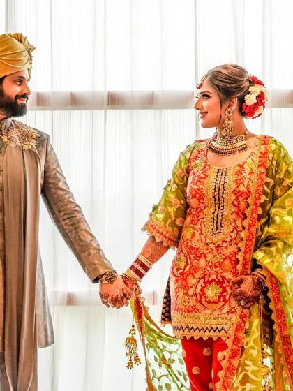 "I want all of you, every day." A simple, beautiful portrait of the couple holding hands, their gazes locked in a moment of shared love and commitment.