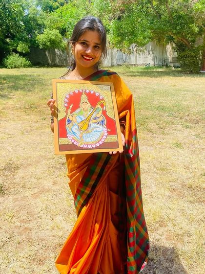 Holding my finished Mysore-style painting. Embracing and learning this heritage art form is something I take great pride in as an artist from Mysore.