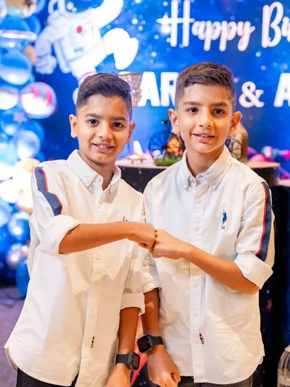 It was double the fun celebrating these twin boys on their birthday. Capturing the unique bond between siblings, especially during a milestone event, is so special. This fist bump moment perfectly shows their connection and shared excitement.