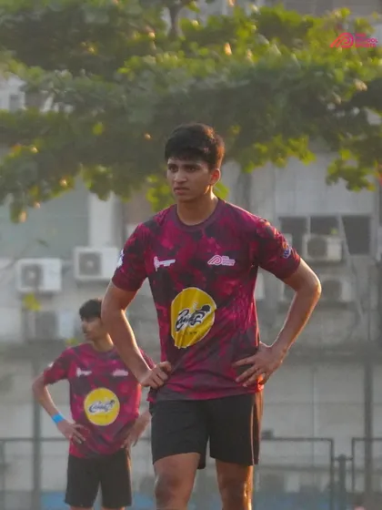 A player stands ready, anticipating the next play with focus and determination.