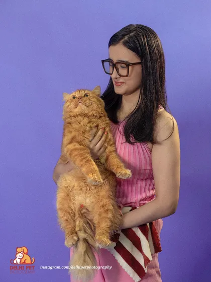 For commercial shoots, we create a fun and comfortable atmosphere for both pets and their humans. Here, we captured a moment of genuine connection between a model and a fluffy Persian cat for a vibrant brand campaign.