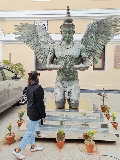 Admiring a beautiful Garuda statue, this photo reflects my appreciation for art, mythology, and culture.