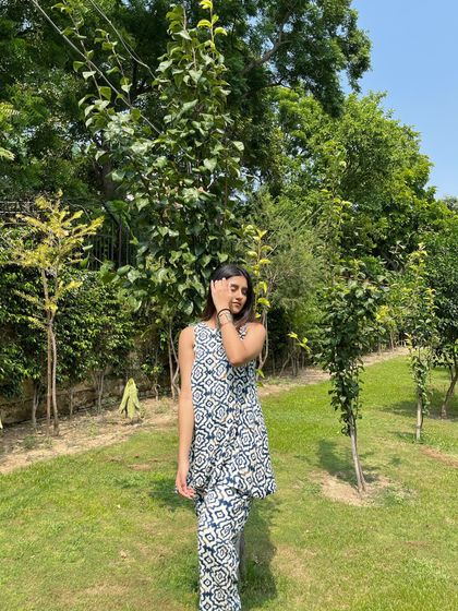"Closer to nature." A peaceful moment in a green park, wearing a comfortable printed co-ord set.