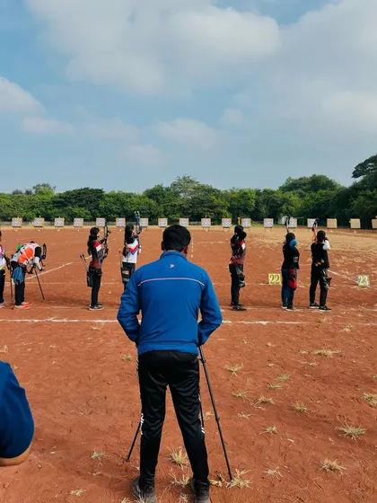 A view from behind the shooting line, watching our archers compete at the state level. My role as a coach is to observe and provide support during these high-pressure moments.