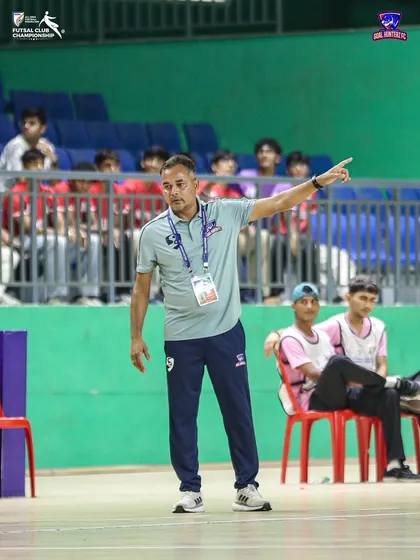 Our head coach directing the team from the sidelines during the quarter-final.