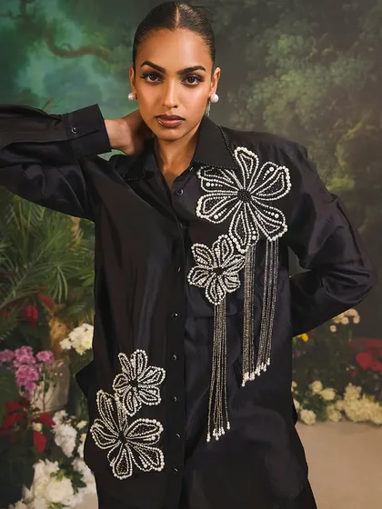 The Azalea Co-Ord Set in black, a stunning blend of sophistication, comfort, and luxury with its floral pearl embellishments and tassel details.