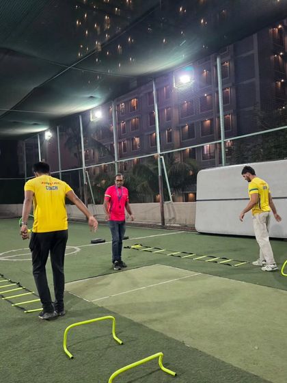 Setting up for success. Before the party kicks off, our team meticulously arranges the agility ladders, hurdles, and cones to create a challenging and fun obstacle course on the turf.