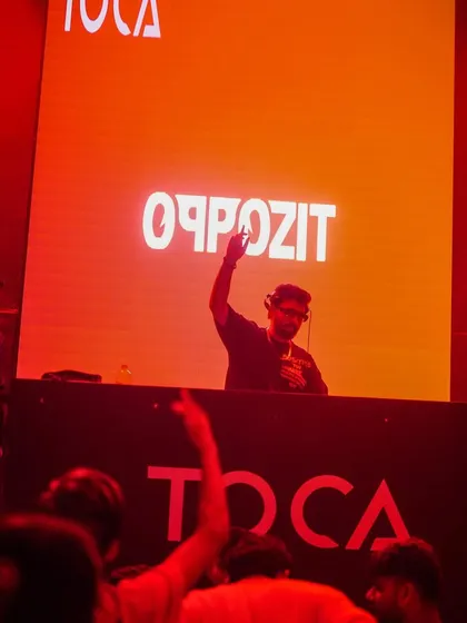 A wide shot from my set at Toca, with my name lit up on the big screen.