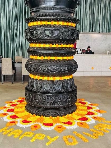 Our iconic lobby pillar decorated with marigold flowers for a festival. We blend our modern design with traditional celebratory elements.