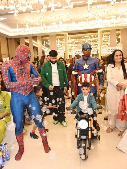 The birthday boy makes his grand entrance on a mini-motorcycle, escorted by Spider-Man and Captain America themselves. Arranging for live character mascots adds that extra layer of magic and excitement for the kids.
