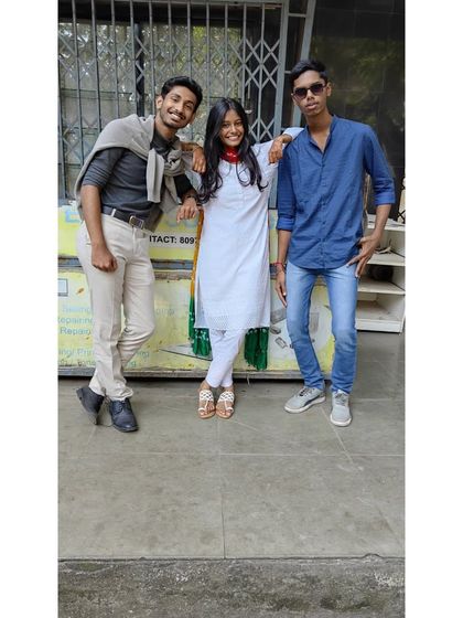 A group of friends posing together on Bollywood Day, showcasing their creative costumes and love for cinema.