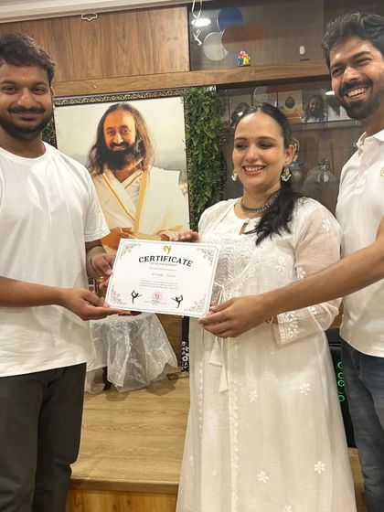 Another proud member of the "Yog Mitra" team being recognized for his performance. These moments build lasting bonds within our studio.