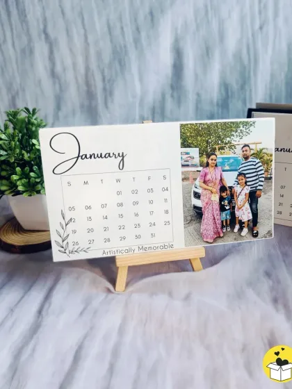 A custom photo calendar card for January, displayed on its wooden easel stand. The clean design lets your photo shine.