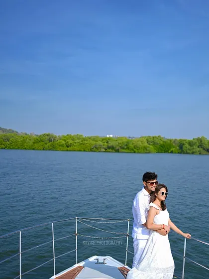 A classic couple pose on a boat, showcasing their connection and the beautiful scenery of their pre-wedding shoot location.