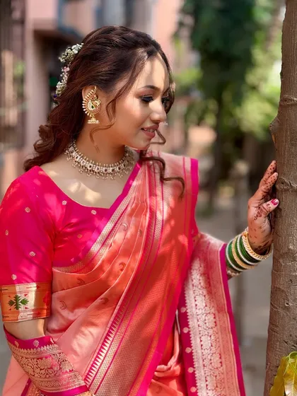 A side profile showing the details of her hairstyle, with delicate flowers woven into the curls, adding a touch of romance to the traditional look.