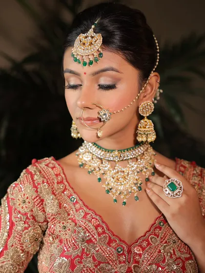 An eyes-closed shot highlighting the beautiful glittery eye makeup. This is a perfect example of a soft glam look with a touch of sparkle.
