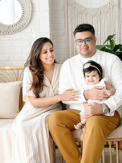 A sweet family portrait in our boho-chic studio. The family is dressed in coordinating neutral tones that perfectly match the natural and earthy feel of the set.