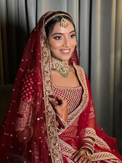 My bride Apurva, looking radiant and happy in her red wedding lehenga.