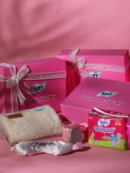 For this PR campaign with Sofy, I designed these vibrant pink gift boxes. The hamper includes branded comfort items like a plush pouch and a satin eye mask, along with a scented candle and the brand's products, creating a complete self-care package.