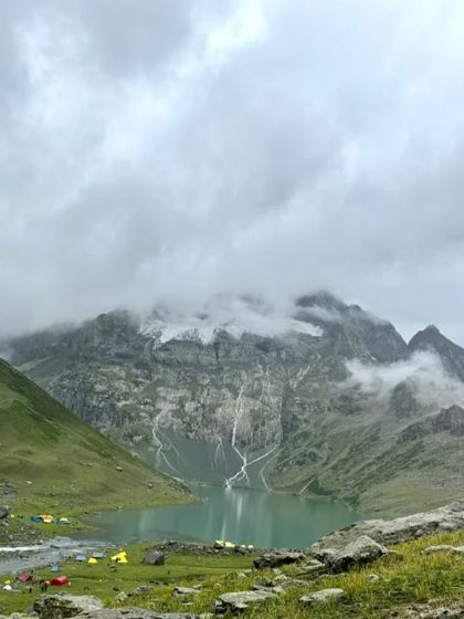 Our campsite nestled by a glacial lake, with waterfalls cascading down the mountainside. Waking up to this view is a truly magical experience.