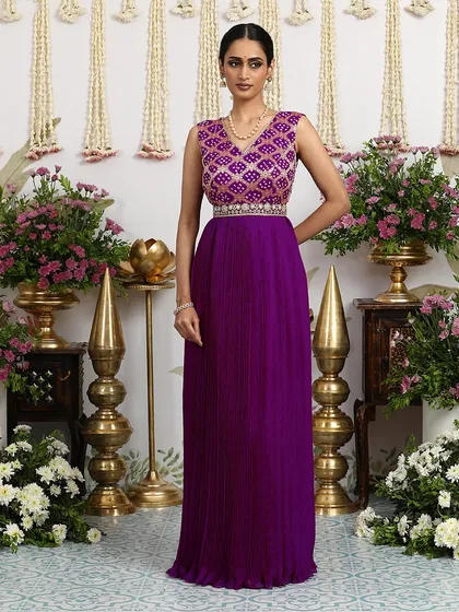 Another angle of the purple gown, showcasing its rich color and flowing silhouette.