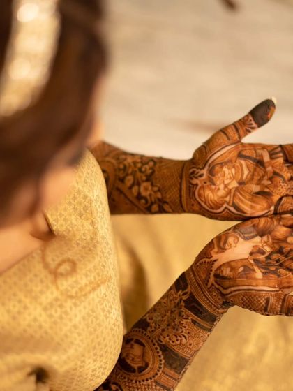A shot from behind the bride, showing the beautiful stain of her mehandi. The color is rich and deep, just as we promise.