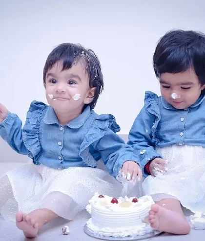 Double the fun, double the mess! These adorable twins are enjoying their first birthday cake smash, and we're here for every giggle and smear of frosting.
