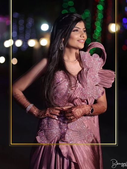 A closer view of the client in the mauve gown, showing the intricate beadwork and pleated fabric. A true work of art.