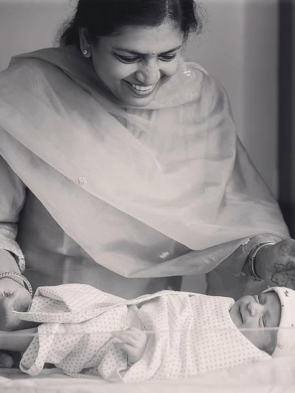 A grandmother's love. This black and white photo from a 'Fresh 48' hospital session beautifully captures the joy and emotion of a grandmother meeting her new grandchild for the first time.