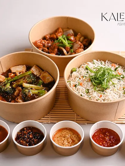 A complete vegetarian weekend spread. This meal includes two different tofu preparations and a large bowl of vegetable fried rice, served with a variety of our house-made sauces.