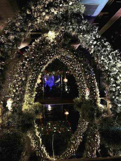 A different angle of the magnificent floral archway, showing its depth and the intricate way the flowers are woven together to create a truly immersive experience.