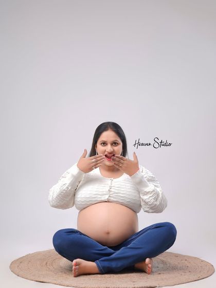 Another take on the playful and surprised expression, this shot captures the pure fun and excitement of waiting to meet your little one.