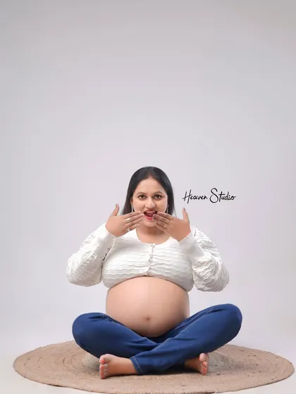 Another take on the playful and surprised expression, this shot captures the pure fun and excitement of waiting to meet your little one.