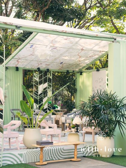 A wide view of 'The Conservatory' structure, showing how it creates a unique and elegant event space.