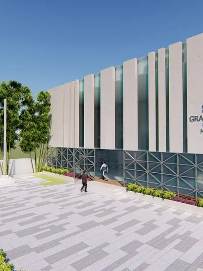 Another perspective of the proposed Grampanchayat office, showing the entrance and the relationship between the building and its surrounding landscape.