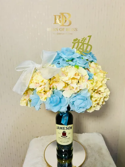 A still shot of the Jameson whiskey floral hamper, topped with a "#1 Dad" accessory.