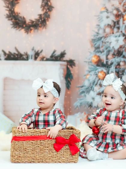 Twin sisters enjoying our Christmas setup. We have props and setups that are perfect for capturing the magic of the holidays with your little ones.