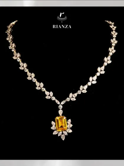 This necklace is centered around a stunning 25-carat yellow sapphire. I designed the setting with marquise and round diamonds to resemble delicate leaves, creating a piece that is both bold and feminine.