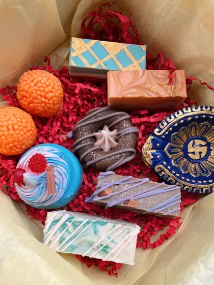 A closer look inside my Diwali gift box. You can see the little laddoo soaps, a donut soap, a cupcake soap, and even tiny diyas, all made from my nourishing soap formula.