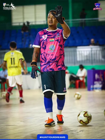 Our goalkeeper warming up before the final. Preparation is key to performance.