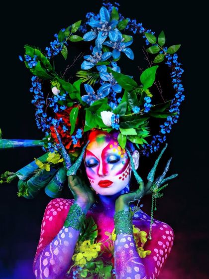 We created this nature-themed fantasy makeup during our creative course. It involves intricate body painting, floral arrangements, and custom props to bring a vision to life.