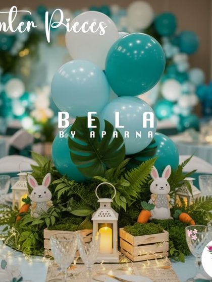 This centerpiece combines a bouquet of blue and white balloons with lush ferns, a white lantern, and small rabbit figures. It's a perfect example of how I create themed table decor that is both beautiful and playful.