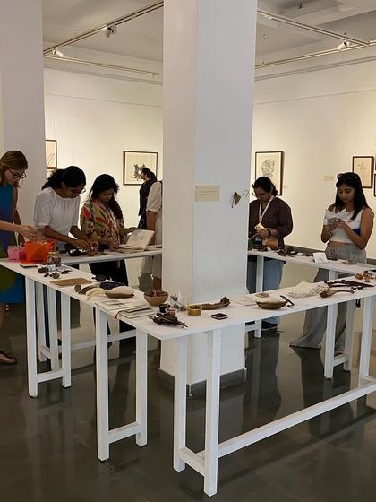 A wide shot of the MAP team's visit, showing their engagement with the overall installation.