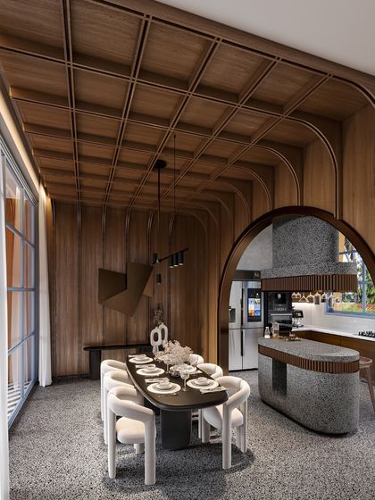 This view shows how the arched wooden partition separates the dining area from the kitchen while maintaining a visual connection. The design is a testament to the idea that details, textures, and forms can shape a space more effectively than solid walls.