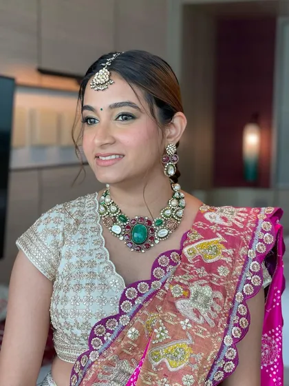 For this Haldi look, I created a sleek, high ponytail with a traditional gotta patti fishtail braid. It's a beautiful fusion of modern and traditional styles.