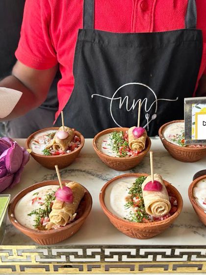 Another look at our popular Dal Makhani Fondue, presented as a pass-around snack. Each serving offers a perfect combination of creamy fondue and a dippable element, served in rustic earthenware.