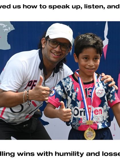 A coach celebrating with a young player who has won a medal. We teach our players to handle wins with humility and losses with courage.